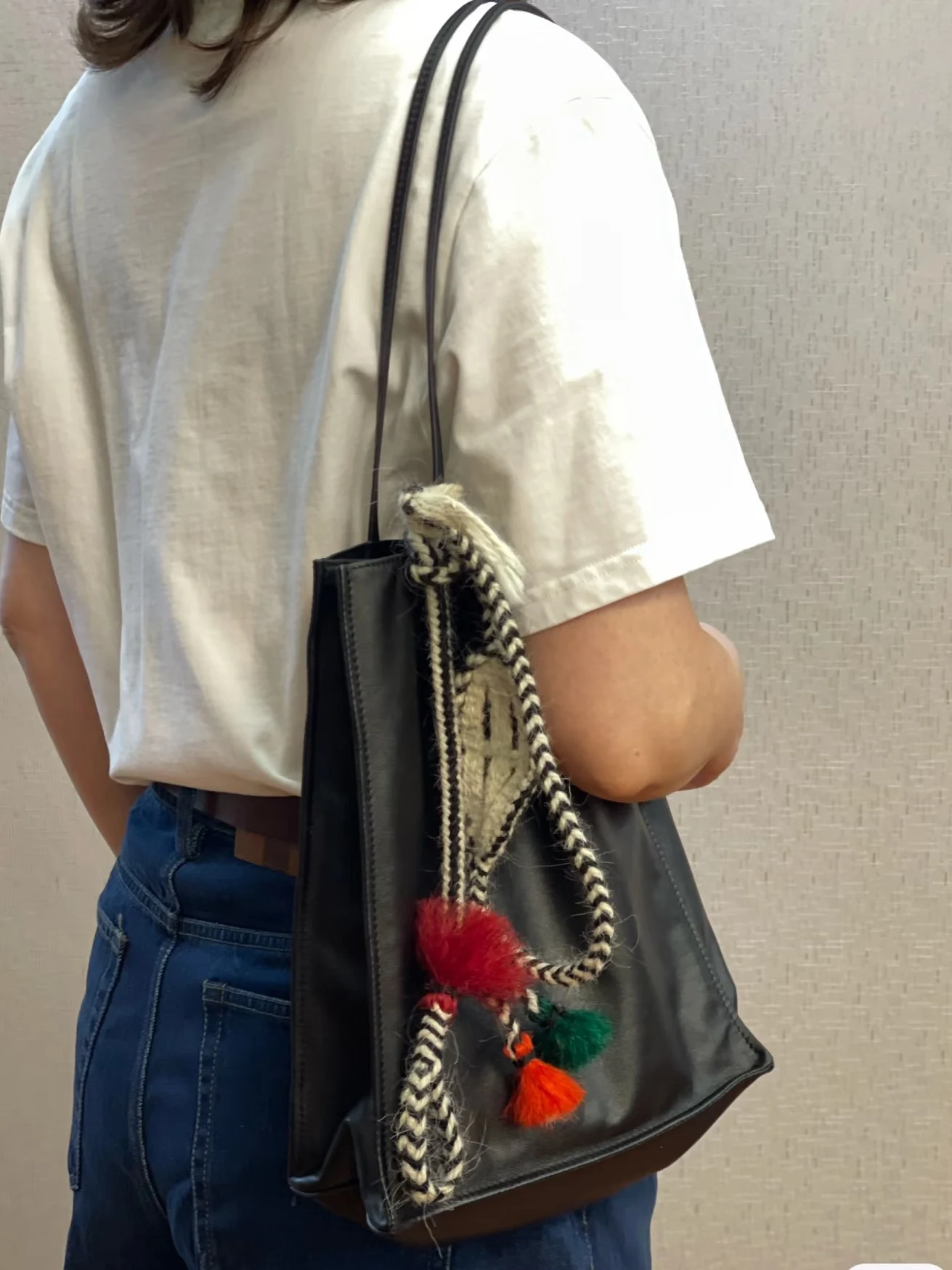 The Original Wurdoo hanging on a black tote